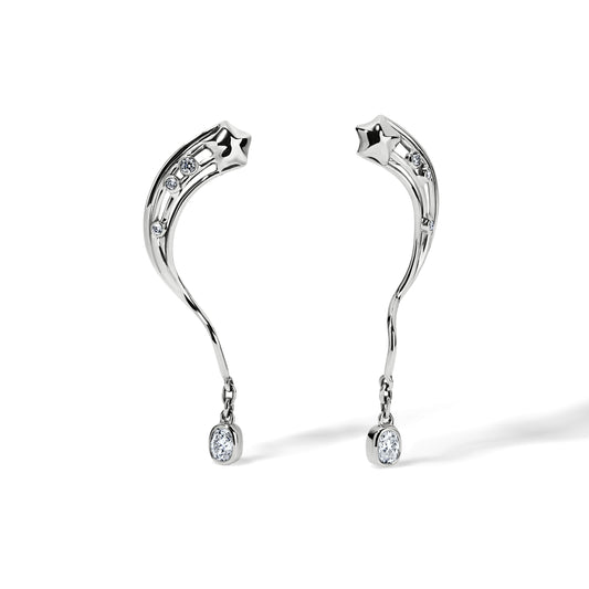 A pair of 14 karat white gold with an oval cushion cut diamond dangling earrings. Three small diamonds are set on the rays of a star coming from the top and these rays are connecting to a dangling diamond.