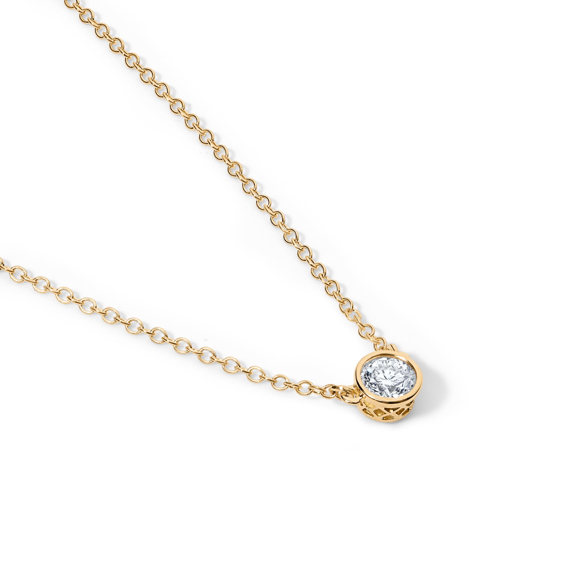 Diagonal view to show the grid pattern on its bezel- of Solitaire Diamond necklace with 18 karat yellow gold metal and cable chain